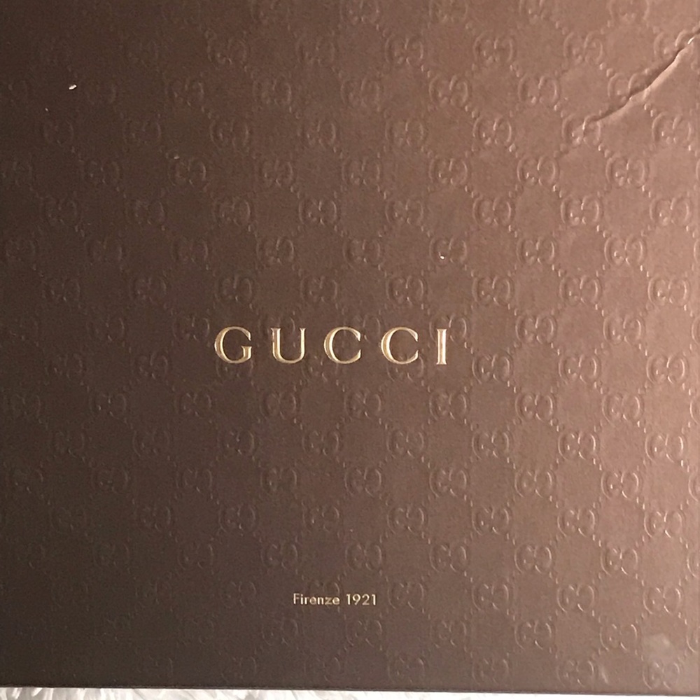 A pair of Gucci Sandals